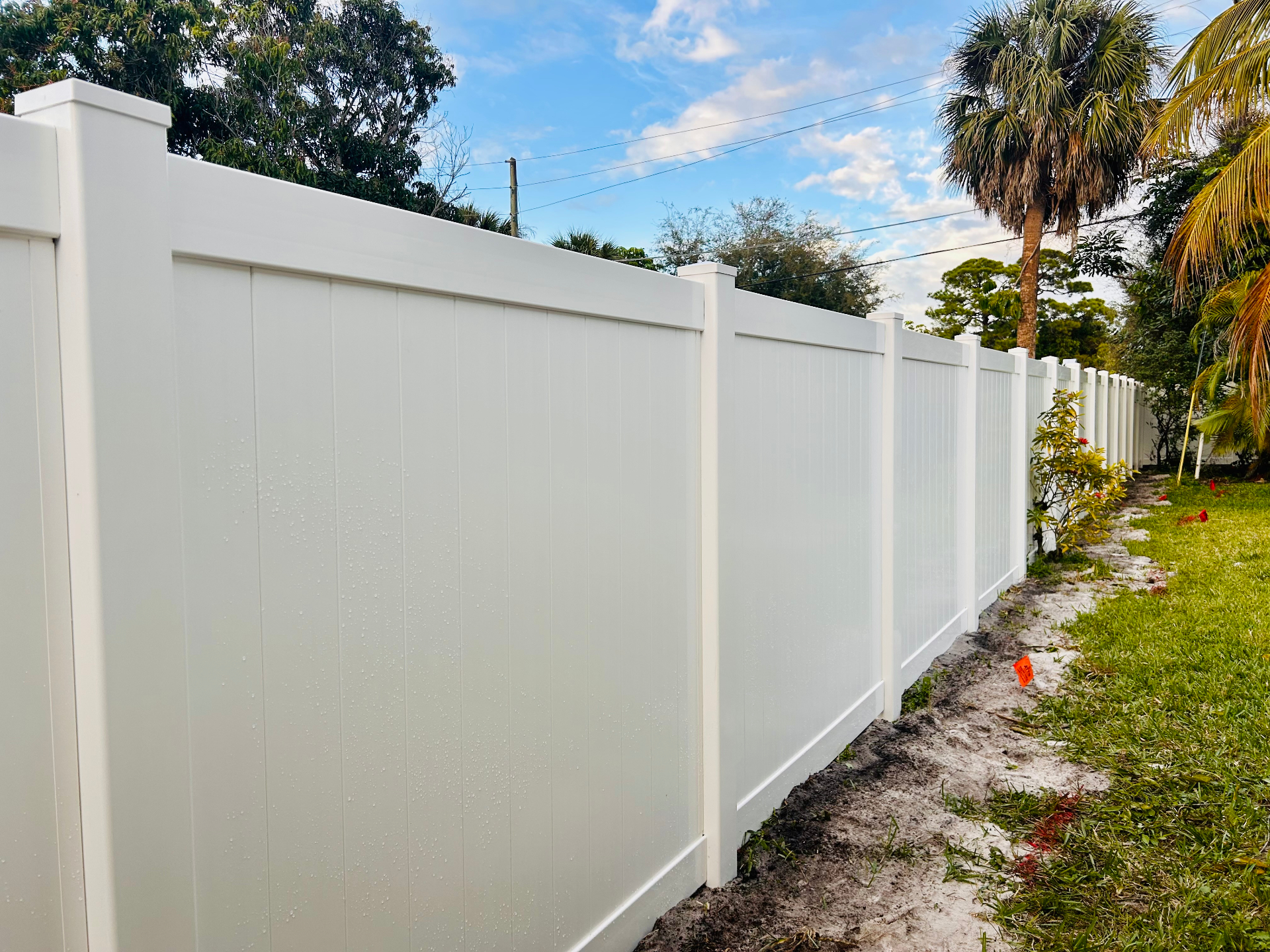 Full-privacy white PVC vinyl fence installed in Martin County, FL