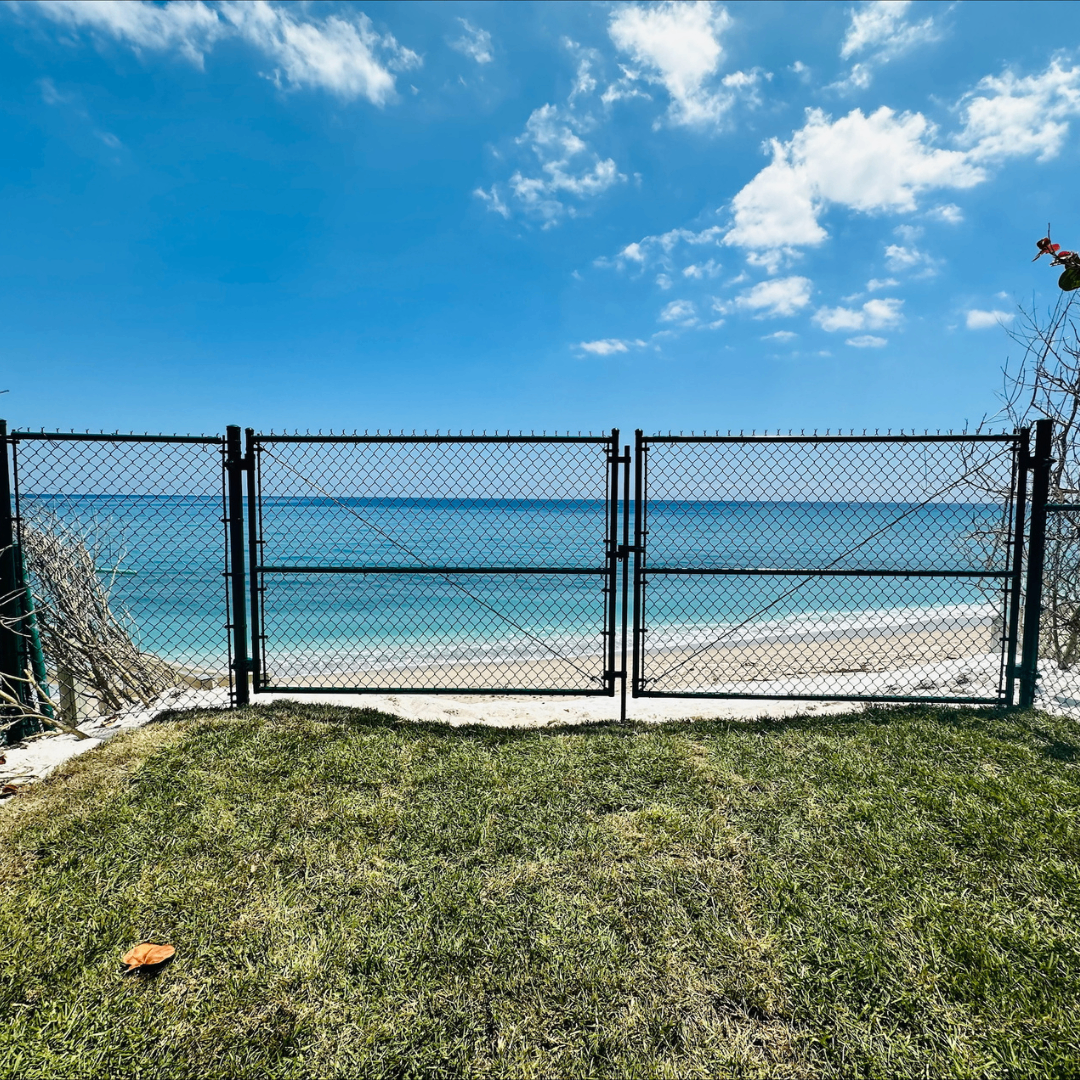 Oceanfront chain-link gate install at coastal property